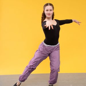 tap dancer showcasing timestep marley dance floor pre-cut